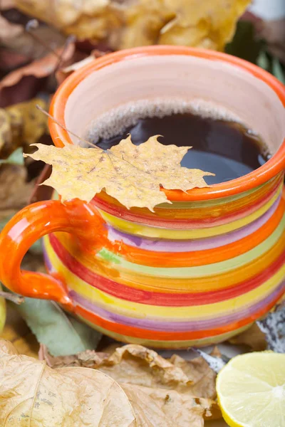Big orange cup with hot tea — Stock Photo, Image