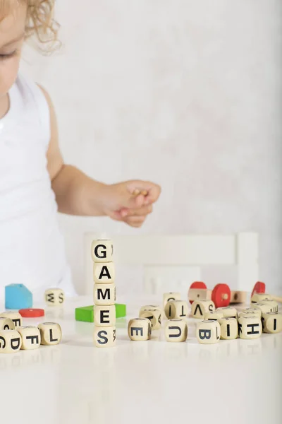 Word Games Composed Wooden Letters Two Years Old Girl Closeup — Stock Photo, Image