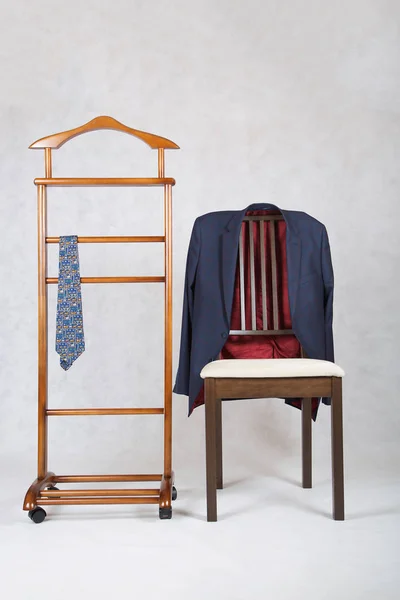 Classical tie on a jacket hanger stand and jacket is hanging on — Stock Photo, Image