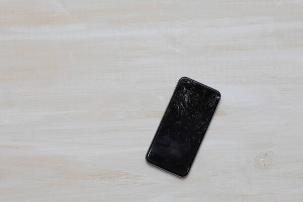 Broken glass of a black smartphone. 