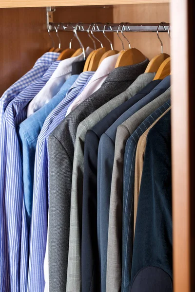 Open wardrobe of a business man. — Stock Photo, Image