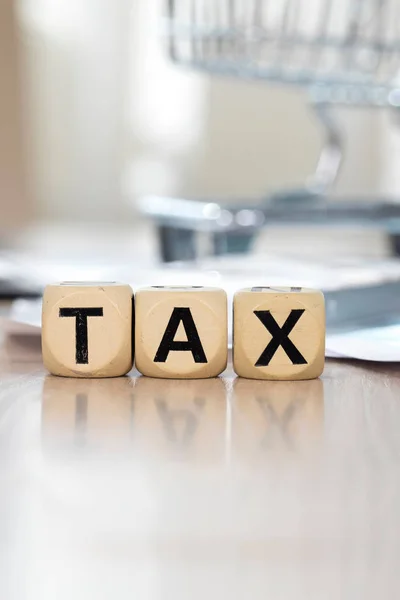 Word TAX composed of wooden letters. Closeup — Stock Photo, Image