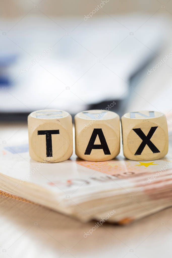Word Tax composed of wooden letters.  Closeup