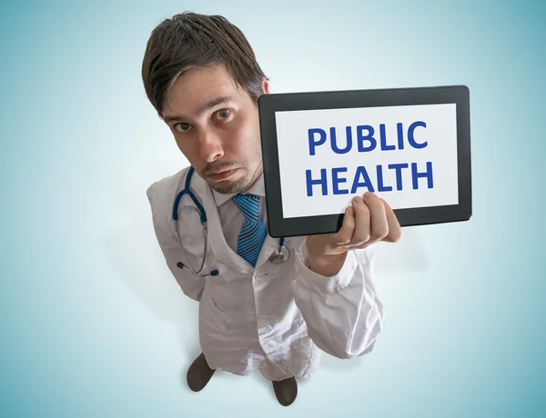 Doctor is showing tablet with public health text written. View from top. — Stock Photo, Image