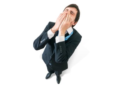 Hayal kırıklığı kavramı. Mutsuz işadamı üstten. Beyaz arka plan üzerinde izole.