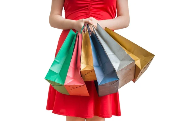 Женщина держит в руках много разноцветных мешков. Концепция покупок. Изолированный на белом фоне . — стоковое фото