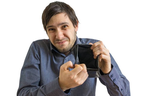 Young man is showing his empty wallet. Bankruptcy and insolvency concept. Isolated on white background.