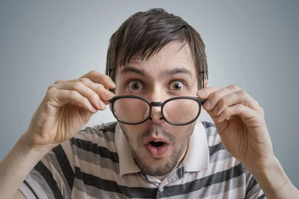 Funny man has open mouth and is surprised and shocked. — Stock Photo, Image