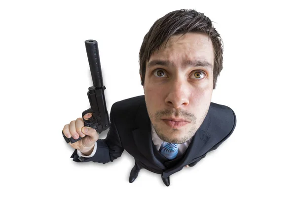 Fiatal ügynök vagy a gyilkos fegyvert a kezében hangtompítóval. Elszigetelt fehér background. Nézd meg felülről. — Stock Fotó