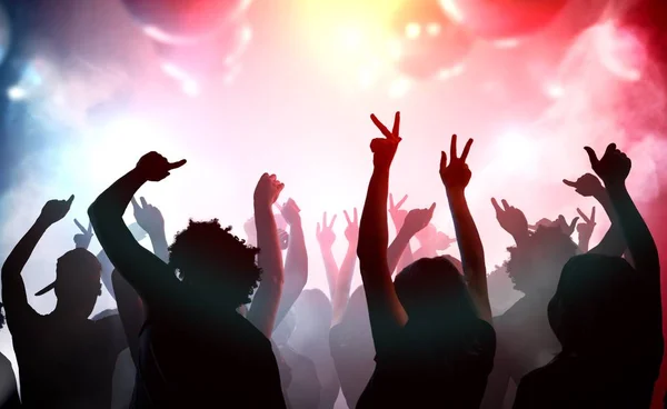 Silhouettes of young people dancing in club. Disco and party con — Stock Photo, Image
