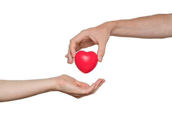 Heart transplant and organ donation concept. Hand is giving red 