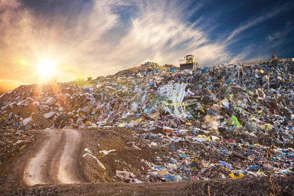 Pollution concept. Garbage pile in trash dump or landfill at sun — Stock Photo, Image