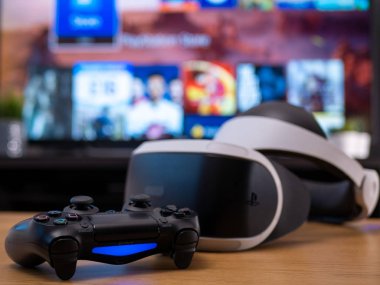 UK, Jan 2020: Virtual reality VR Sony headset for Playstation with Dualshock remote controller clipart