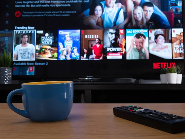 UK, Jan 2020: Netflix trending now menu displayed on television set in home setting — Stock Photo, Image