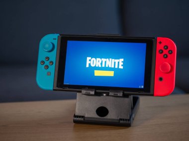UK - Feb 2020: Nintendo Switch with Fortnite game logo on screen