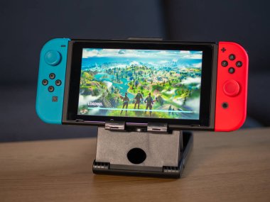 UK - Feb 2020:Nintendo switch games console with Fortnite game on screen