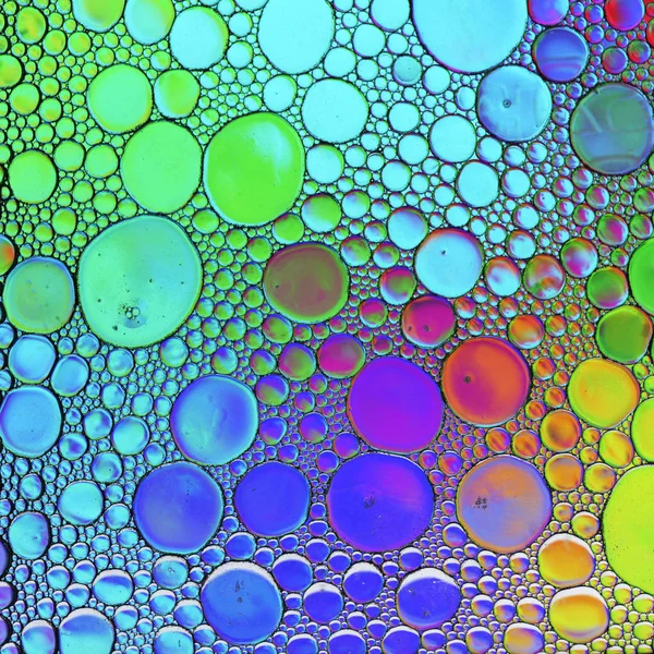 Abstrakcyjne wielokolorowe bańki mydlane olejku wody mieszane tekstury — Zdjęcie stockowe