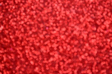 Parıldayan ile parlak ve soyut kırmızı arka plan bulanık glitter