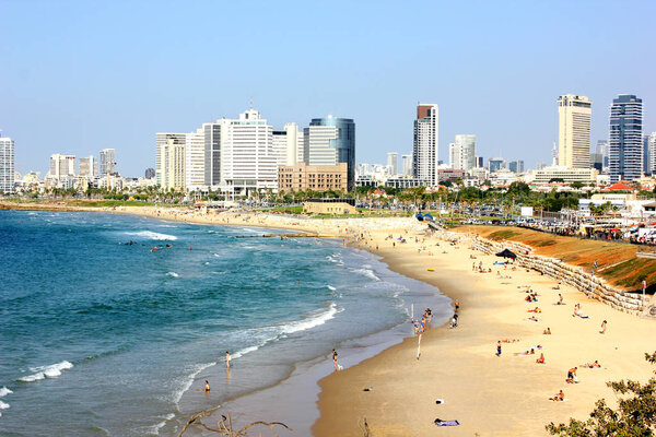 Tel Aviv beach coast with a view of Mediterranean sea and skyscrapers