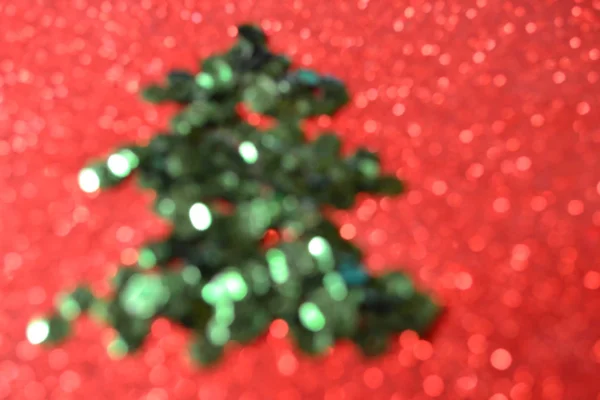 Bright and abstract blurred colorful Christmas tree background with shimmering glitter — Stock Photo, Image