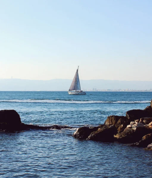 Beautiful small yacht sailing on blue Mediterranean sea