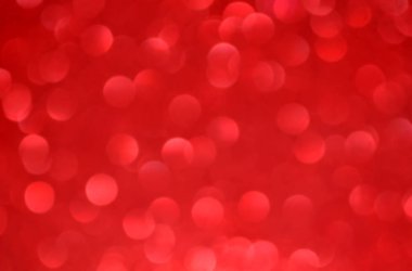 Parıldayan ile parlak ve soyut kırmızı arka plan bulanık glitter