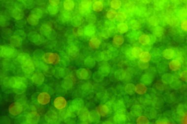 Parıldayan ile parlak ve soyut yeşil arka plan bulanık glitter