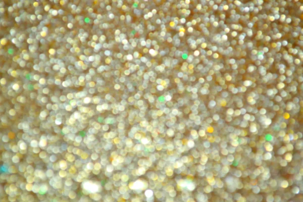 Bright and abstract blurred star golden background with shimmering glitter — Stock Photo, Image