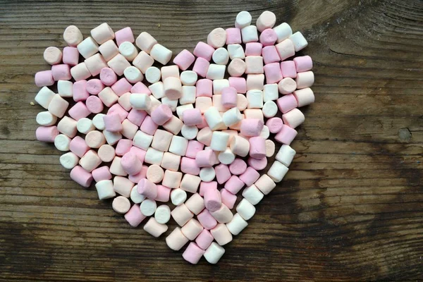 Lots of little marshmallows in shape of a heart — Stock Photo, Image