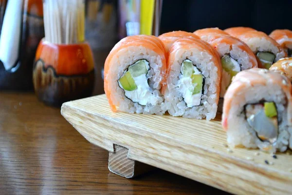 Delicious rolls and sushi with eel, salmon and cream cheese — Stock Photo, Image