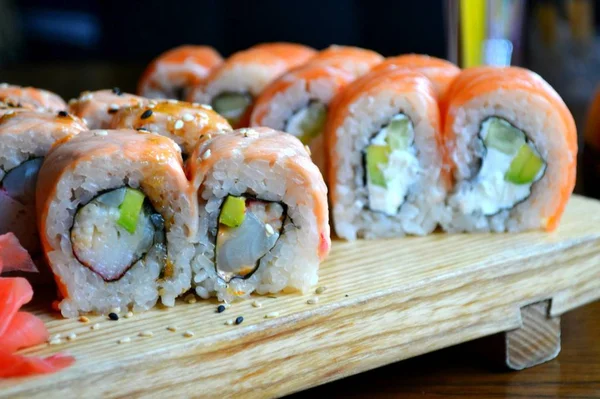 Delicious rolls and sushi with eel, salmon and cream cheese — Stock Photo, Image