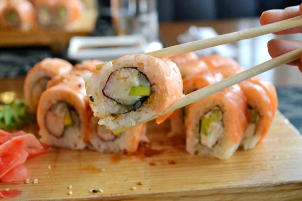 Delicious rolls and sushi with eel, salmon and cream cheese — Stock Photo, Image