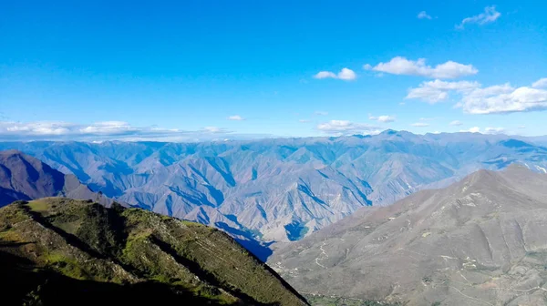 Mountainous landscape in which you can see the road that connects the cities of the mountains and jungle of Peru