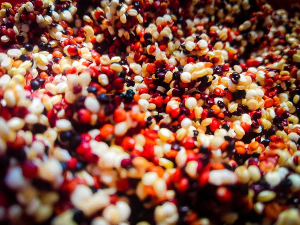 Close up of a pile of raw tricolor quinoa. Healthy and gluten free food.