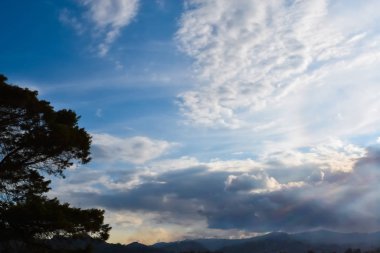 Different types of clouds in the blue morning sky