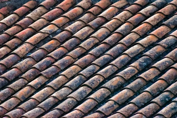 Ceiling of worn red tiles, architecture background.