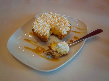 Dessert, lemon tartlet served on a white plate