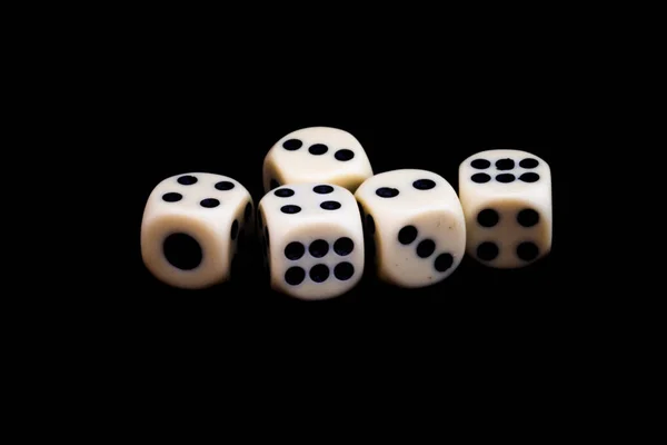 Five dices on a black background ready for starting the games — Stock Photo, Image