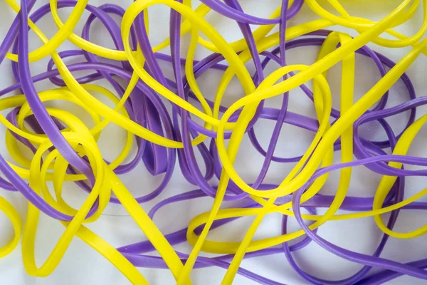 Pile of colorful small rubber bands isolated on a white back ground — 图库照片