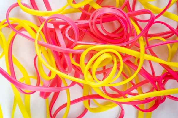 Pile of colorful small rubber bands isolated on a white back ground — 图库照片