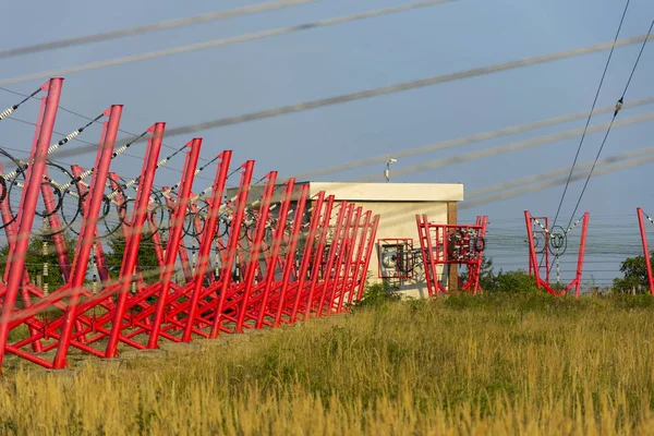 Communication wires lead to switching station from radio transmitter tower