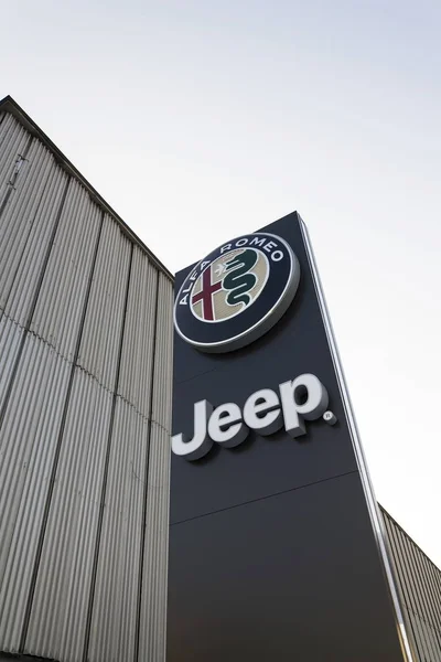 Jeep and Alfa Romeo car logo on dealership building on January 20, 2017 in Prague, Czech republic. American regulator EPA investigate Fiat Chrysler Automobiles for emissions cheating. — Stock Photo, Image