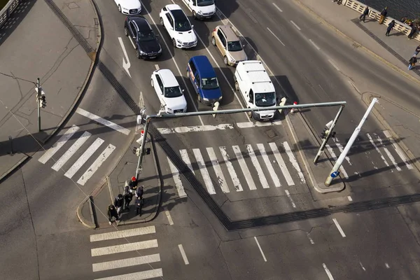 Bird's eye view of cars crossing intersection with people walking on crosswalk on March 3, 2017 in Prague, Czech republic. Volkswagen unveils electirc self-driving van on Geneva Motor Show. — Stock Photo, Image