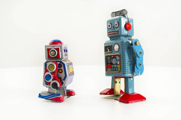 Two vintage tin toy robots isolated on white background — Stock Photo, Image