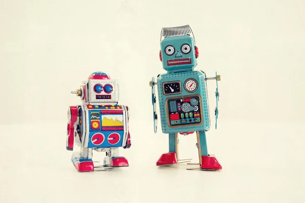 Filtered vintage tin toy robots isolated on white background — Stock Photo, Image