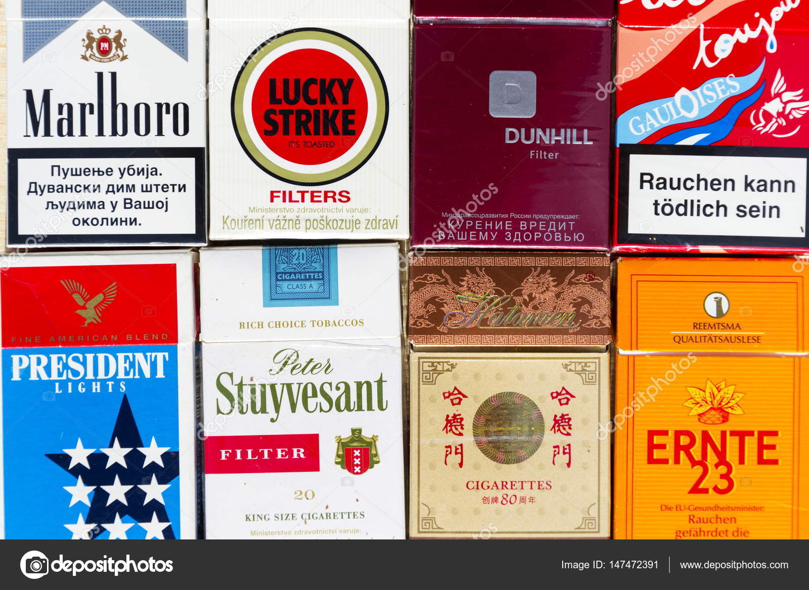 Many packs of different cigarettes photographed with top view flat lay composition on March 25