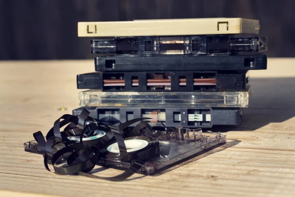 Old broken unwound compact cassette audio tape messed up — Stock Photo, Image