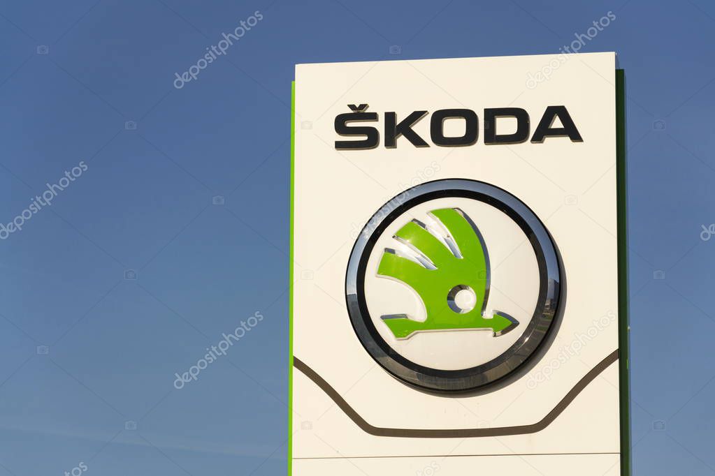 PRAGUE, CZECH REPUBLIC - MARCH 31: Skoda Auto automobile manufacturer from Volkswagen Group company logo in front of dealership building on March 31, 2017 in Prague, Czech republic. Skoda plans 5 fully-electric vehicles on sale by 2025.