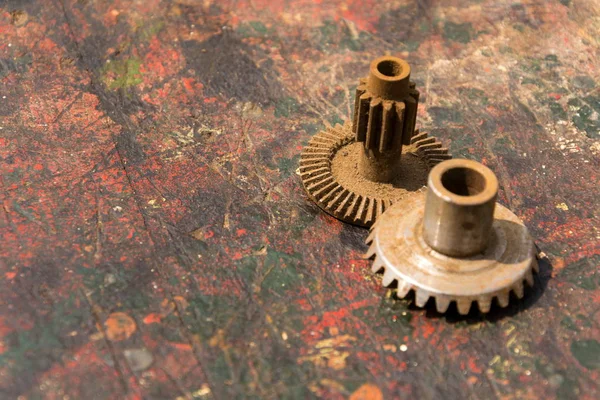 Filtered picture of cogwheels on a colorful wooden background — Stock Photo, Image