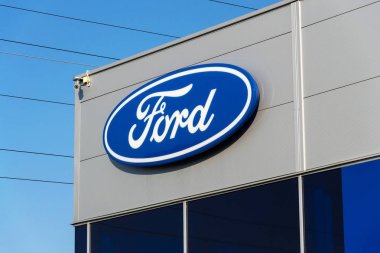 Ford motor company logo on dealership building  clipart